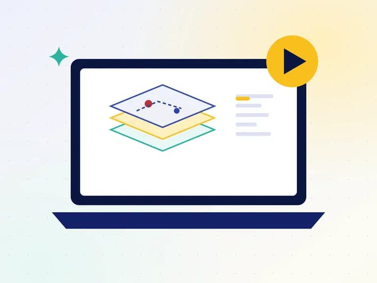 Laptop showing map layers and a video